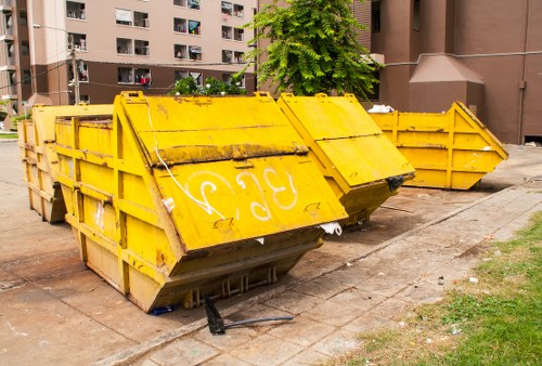 Construction site with waste clearance in progress in Euston